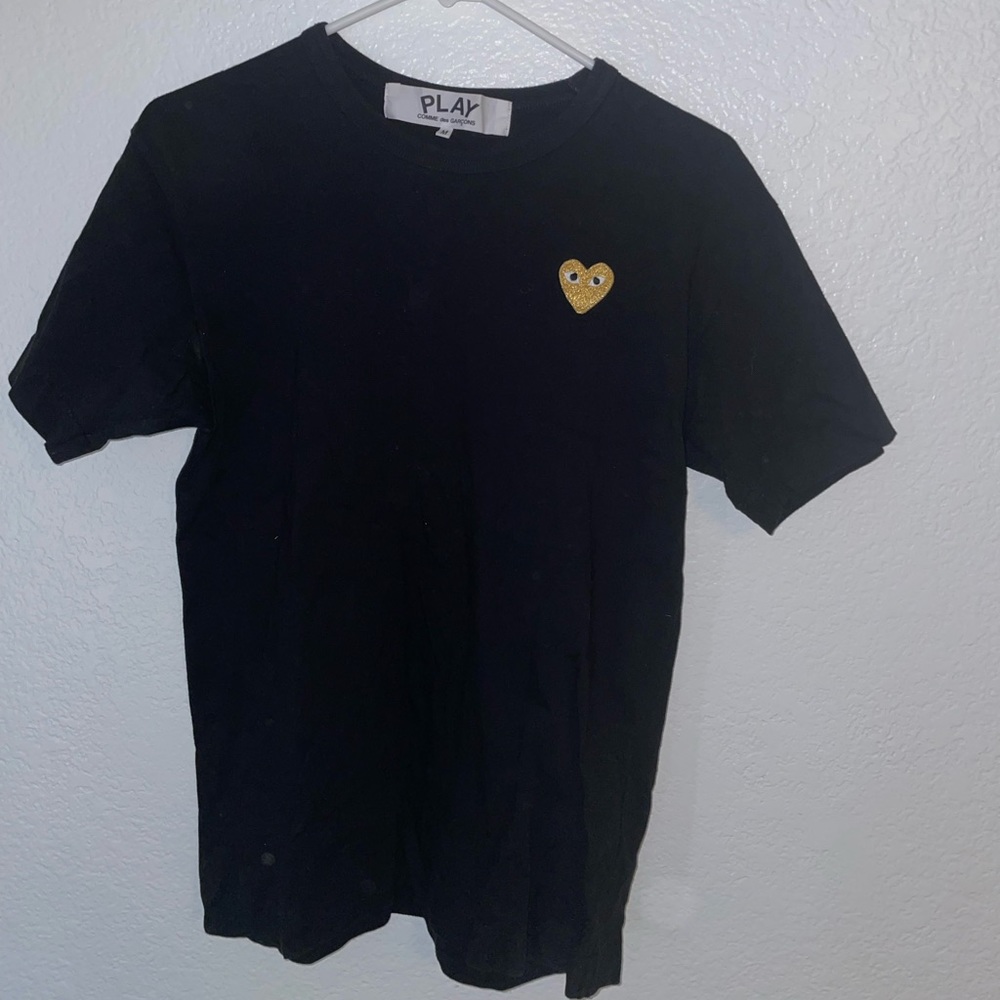 black comme des garcons shirt. glare from flash in photos.